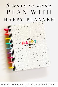 a planner with the words i am a happy planner written on it and colored pencils