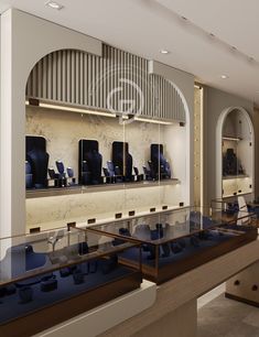 a room filled with lots of blue chairs next to a wall covered in glass shelves