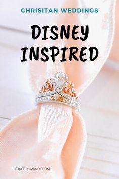 a wedding ring with the words disney inspired written on it, sitting on top of a napkin