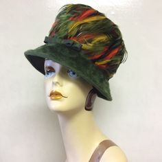 Gorgeous great condition! This hat is fantastic! Feathers are beautiful. Green Brimmed Felt Hat For Fall, Vintage Multicolor Hats For Fall, Green Short Brim Felt Hat For Fall, Green Felt Hat With Short Brim For Fall, Green Brimmed Hat For Fall, Winter Hat With Feather Trim, Green Brimmed Felt Hat For Winter, Winter Felt Hat With Feathers And Short Brim, Green Cloche Hat For Winter