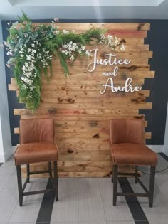 two brown chairs sitting in front of a wooden wall that says justice and aukle