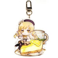 a key chain with a cartoon character holding a piece of cake on top of it