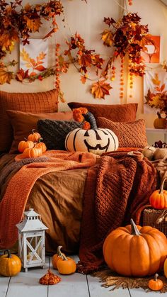 a bedroom with pumpkins and decorations on the bed