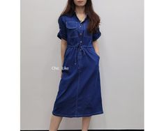 Item No. SZ21 Material: Cotton Color: Blue US Size:XS, S, M, L, XL, 1XL - Handcrafted. - Denim Dress. - Midi Length. - Pockets. - Collared. - Button. - A Line. - Sleeves. - Elastic waist. - Made ethically with a lot of love and care. Casual Indigo Dress With Pockets, Casual Knee-length Denim Dress With Pockets, Casual Indigo Denim Dress With Buttons, Indigo Denim Short Sleeve Dress With Pockets, Knee-length Relaxed Fit Denim Blue Dress, Knee-length Denim Blue Denim Dress With Pockets, Knee-length Relaxed Fit Denim Dress, Denim Blue Relaxed Fit Knee-length Dress, Knee-length Denim Blue Dress With Pockets