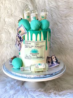 a cake decorated with money and blue icing