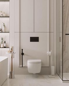 a modern bathroom with white walls and marble flooring