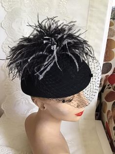 "Vintage 1970's dark Black Wool Felt hat. Has veiling with Black and White feathers. Label is *Miss Bierner*. Made in USA. *MORE INFORMATION BELOW* CONDITION: No issues noted. MEASURES: Inside circumference~21\" Front to back~7\" Left to right~8\" *WE APOLOGIZE~BUT WE NO LONGER SHIP TO GERMANY, ITALY OR SPAIN. IF ORDERS COME IN FROM GERMANY, ITALY OR SPAIN, WE WILL HAVE TO CANCEL THEM AND REFUND YOUR MONEY. SORRY FOR THIS INCONVENIENCE*" Black Brimmed Fall Costume Hat, Black Brimmed Costume Hat For Fall, Brimmed Black Costume Hat For Fall, Vintage Wide Brim Mini Hat For Fall, Fitted Black Costume Hats For Fall, Fitted Black Costume Hats And Headpieces For Fall, Retro Black Costume Hats And Headpieces For Party, Retro Black Costume Hat For Party, Vintage Black Cloche Hat For Fall