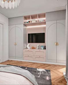 a bedroom with white and pink furniture and a chandelier hanging from the ceiling