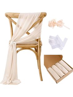 a wooden chair with white cloth draped over it