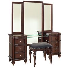 a dressing table with mirror, stool and drawers