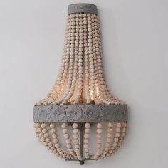 a chandelier with beads hanging from it's sides