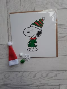 a christmas card with a cartoon dog wearing a santa hat