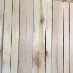 a cat sitting on top of a wooden floor