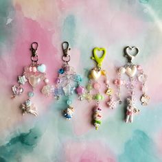 several charms are arranged on a colorful background