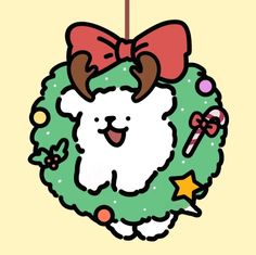 a christmas wreath with reindeer antlers and a bow hanging from it's side