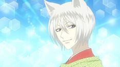 an anime character with white hair wearing a green and red shirt in front of blue hexagonal background