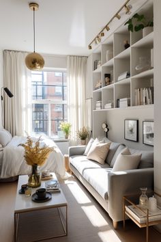 a living room filled with furniture next to a window covered in white sheets and pillows