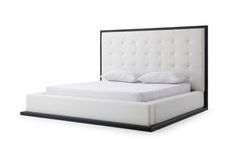 a bed with white linens and black frame on the headboard is shown in front of a white background