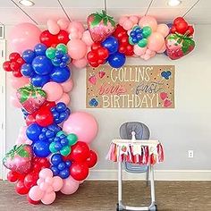 the balloon arch is decorated with red, white and blue balloons