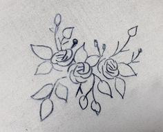 a drawing of some flowers on a white surface