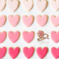 heart shaped cookies arranged in the shape of hearts with a ring on one side and two rows of smaller ones behind them