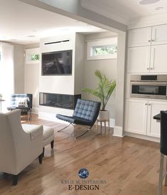 a living room filled with furniture and a flat screen tv mounted to the wall over a fireplace