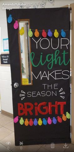 a door decorated with the words your light makes the season bright