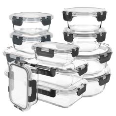 six glass containers with lids and black handles