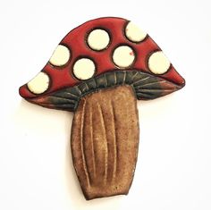 a red and white mushroom with polka dots on it's cap is shown against a white background