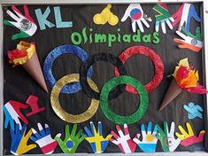 the olympic sign is decorated with handprints and streamers for children to use