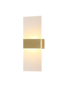 a light that is on the side of a wall with a white and gold finish