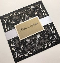 a black and white wedding card with a name tag on the front that says, fabulous and fun