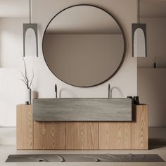 a bathroom with a large round mirror above the sink and wooden cabinetry on the wall