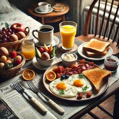 a table topped with plates of food and glasses of orange juice next to eggs, bacon, toast, and fruit