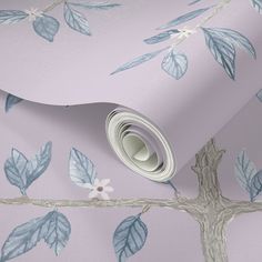 a pink wallpaper with blue leaves and white flowers on the bottom half of it