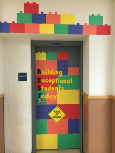 a colorful door with the words building exceptional students today written on it in lego blocks