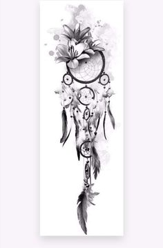 a black and white drawing of a dream catcher with flowers on it's side