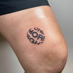 a woman's thigh with the words one more night written on it in black ink