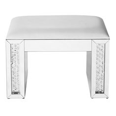 an acrylic stool with crystal trimmings on the legs and foot rest