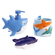 three different types of toothbrush holders with sharks on them