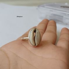 Natural Money Cowrie Sea shell ring, handmade ring, gift ring, Natural Sea shell ring, boho ring, women's ring, statement ring, Gift For Her Benefits Of Gemstone : It brings good luck, wealth, prosperity, fame and the power of destiny. Cowry shells are used in some religious or auspicious ceremonies too, like in Laxmi puja Kaudi shells are kept to please Goddess Laxmi and be blessed by Her and Lord Vishnu Those who have these cowries with them during prayer gets the blessing for both Lord Shiva and Goddess Lakshmi and they gain success, prosperity, wealth and fame in life. Cowries are also used as a tool to save children from evil and negativity. Thanks For Visiting My Shop. Bhagirath Silver Shell-shaped Ring For Gift, Handmade Open Ring Jewelry For Beach, Nickel-free Shell Gift, Silver Shell Rings For Beach, Handmade Silver Shell For Beach, Silver Shell Rings For Gift, Adjustable Open Ring Jewelry For Beach, Adjustable Open Ring Jewelry For The Beach, Handmade White Shell Rings