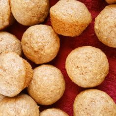 some muffins sitting on top of a red cloth