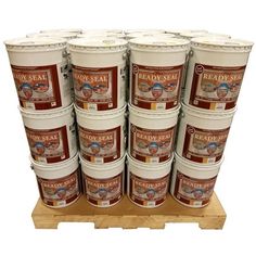 six buckets of ready seal paint on a pallet