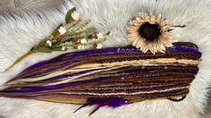 Handmade Dreadlocks  Material: Kanekalon Synthetic Hair Color: Blonde, Brown, & Purple  Decor: Thread, Beads, and Jewels Length: 22-24" Quantity optional  Ready to Ship Hair Color Blonde Brown, Dreads Blonde, Handmade Dreadlocks, Thread Beads, Hair Color Blonde, Purple Decor, Synthetic Hair