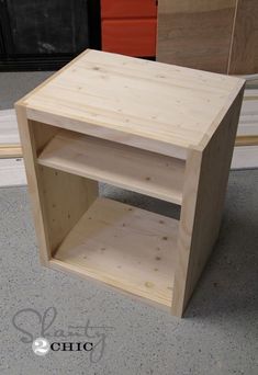 a wooden shelf sitting on top of a floor