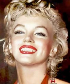 a woman with blonde hair and red lipstick