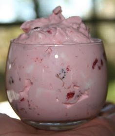 a close up of a dessert in a glass on a table