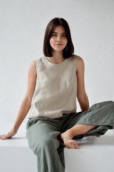 "Natural sleeveless linen top. Handmade linen basic tank top. Choose size: XS Bust 82 - 84 cm. ( 32 1/4\" - 33\") Waist 66 - 68 cm. / (26\" - 26 3/4\") Hips 90 - 92 cm. / (35 1/2\" - 36 1/4\") S Bust 86 - 88 cm. ( 33 3/4\" - 34 3/4\") Waist 70 - 72 cm. / (27 3/4\" - 28 1/4\") Hips 94 - 96 cm. / (37\" - 37 3/4\") M Bust 90 - 92 cm. ( 35 1/2\" - 36 1/4\") Waist 74 - 76cm. / (29 1/4\" - 30\") Hips 98 - 100 cm. / (38 1/2\" - 39 1/4\") L Bust 94 - 96 cm. ( 37\" - 37 3/4\") Waist 78 - 80 cm. / (30 3/4 Linen Top Women, Linen Tank Top, Linen Tank, Blouse Casual, Linen Throw, Top Tank, Linen Blouse, Top Sleeveless, Linen Top