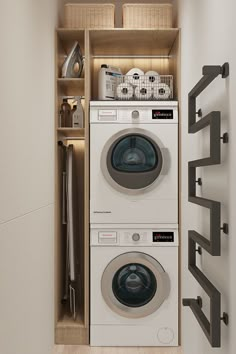 a washer and dryer in a small room next to a shelf filled with items