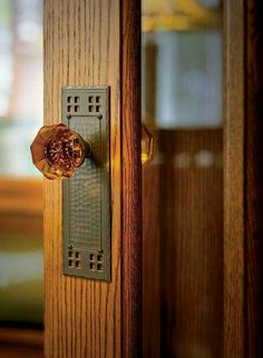 a wooden door with a glass knob on it